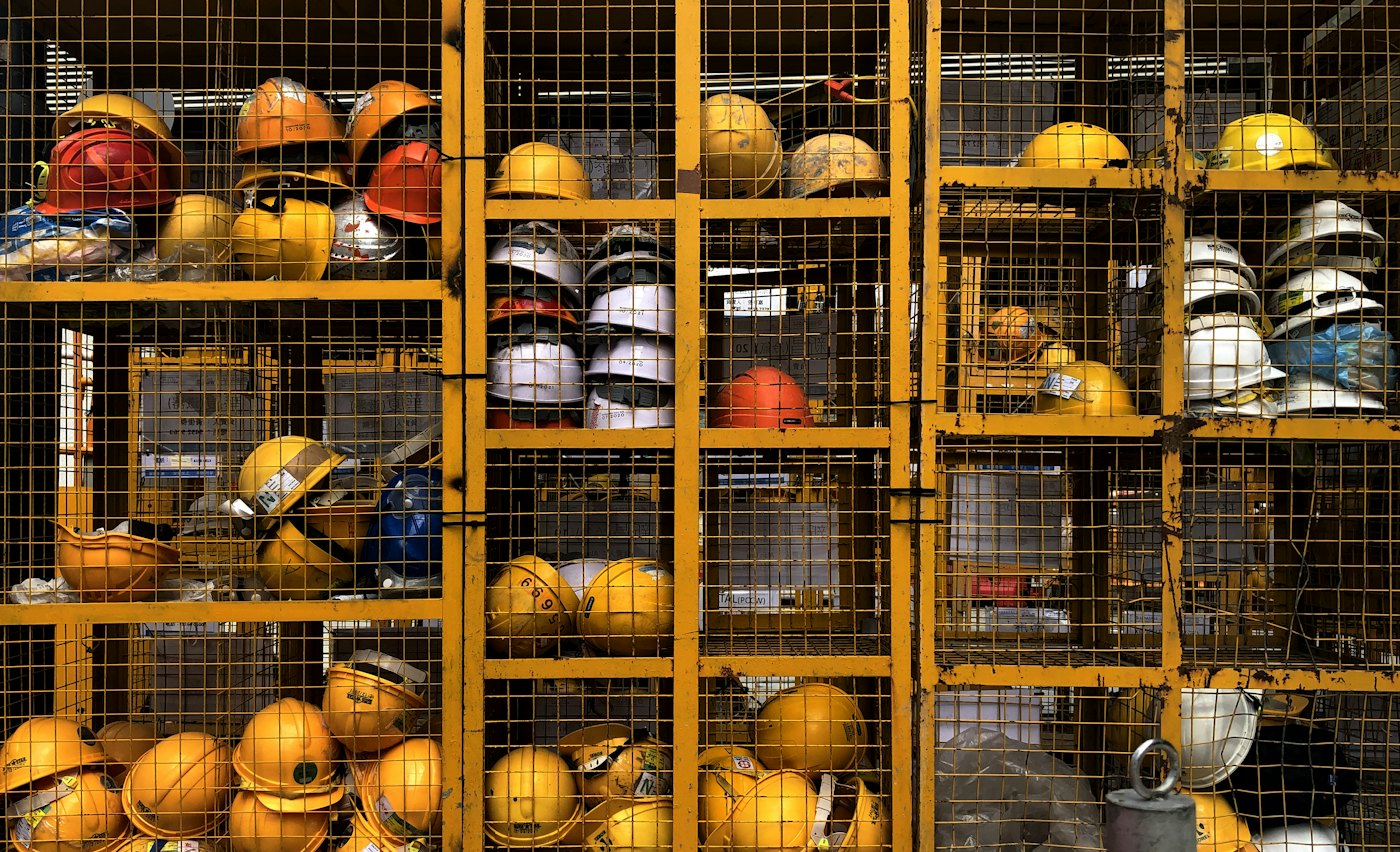 Rack of safety helmets ready for use on site