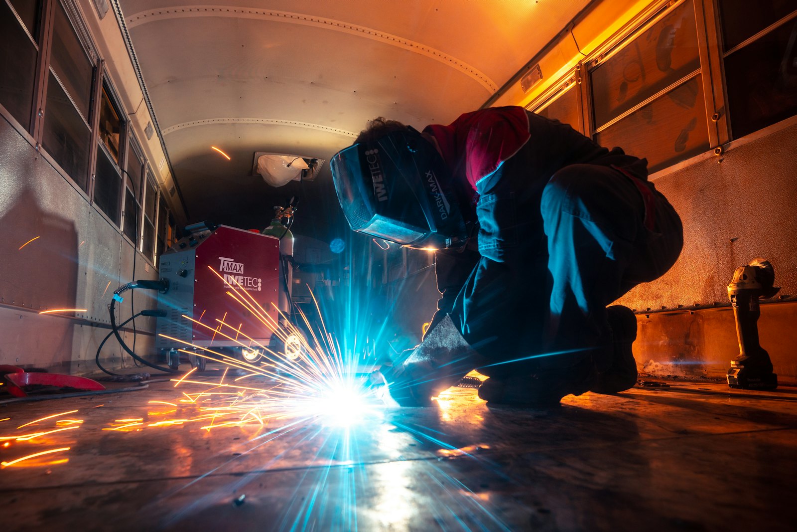Welder at work with sparks